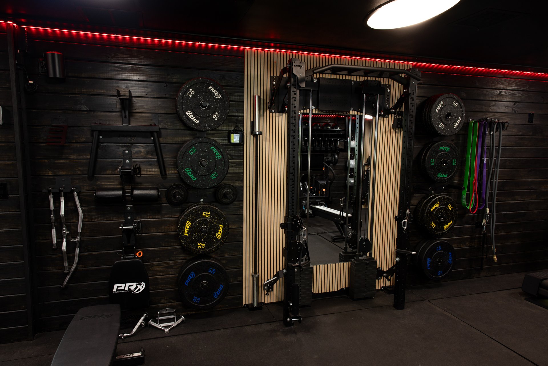 Wall-mounted training equipment and storage inside the gym trailer