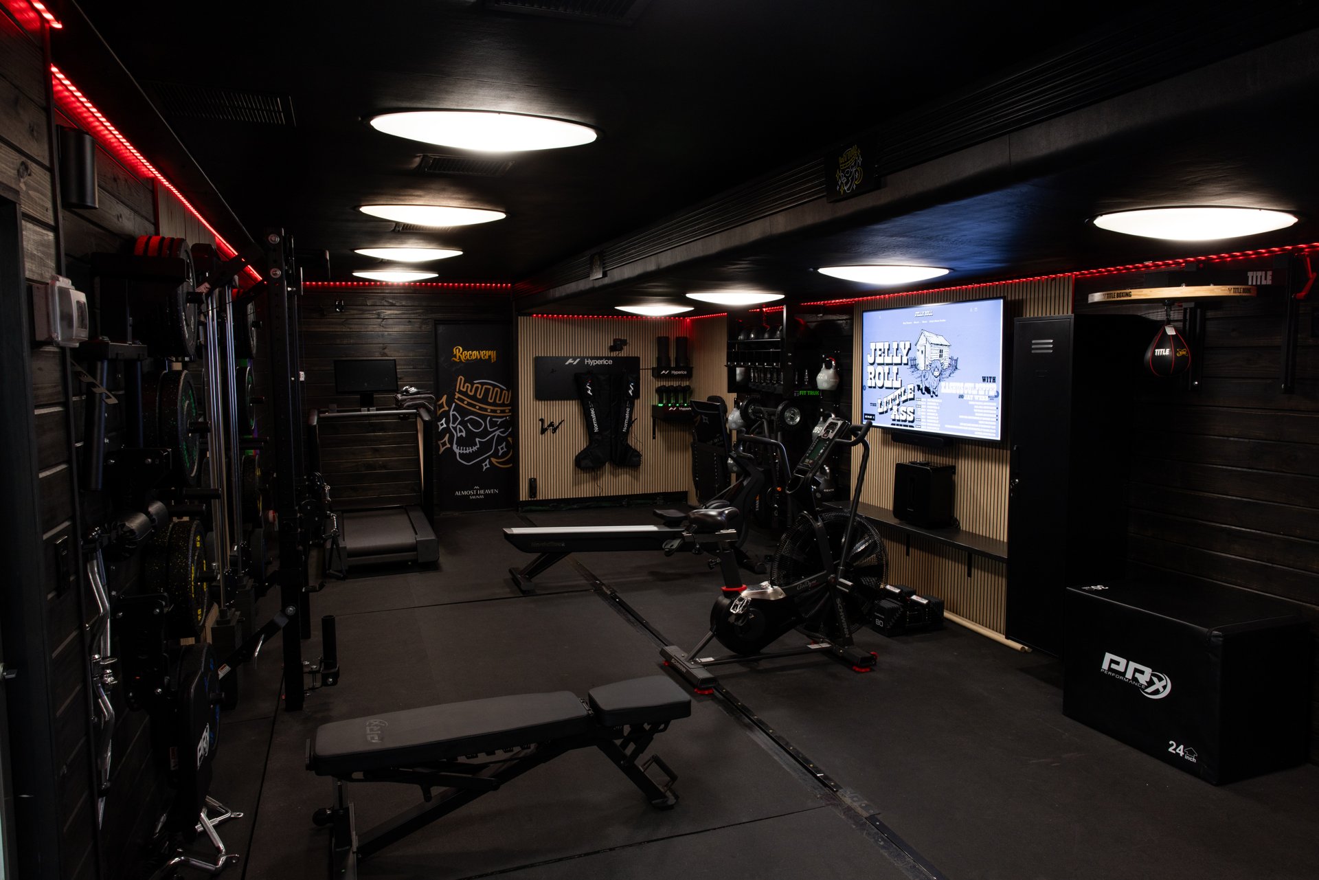 Wide view down the custom gym trailer training space