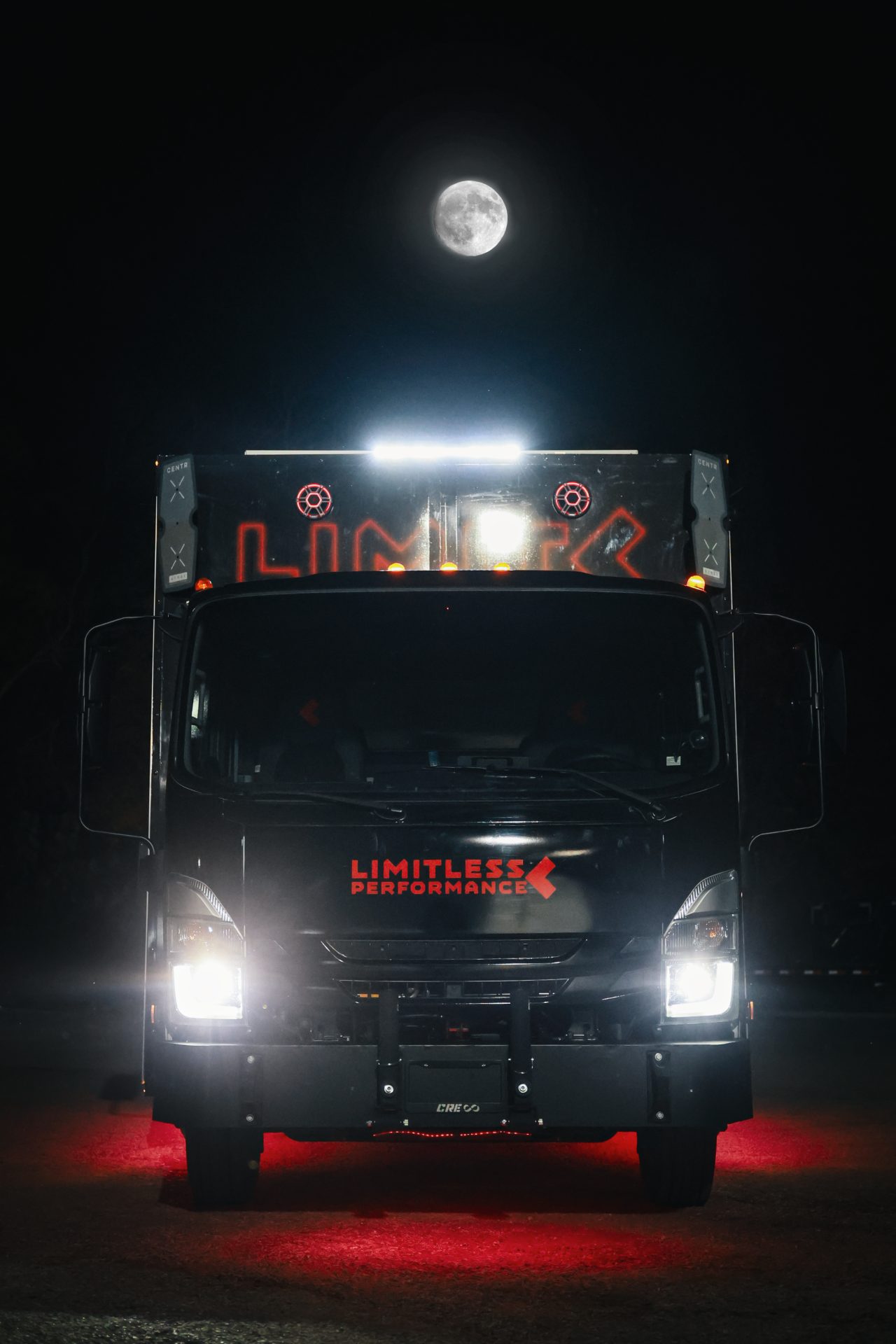 Fit Truk 2.0 front view at night, headlights on