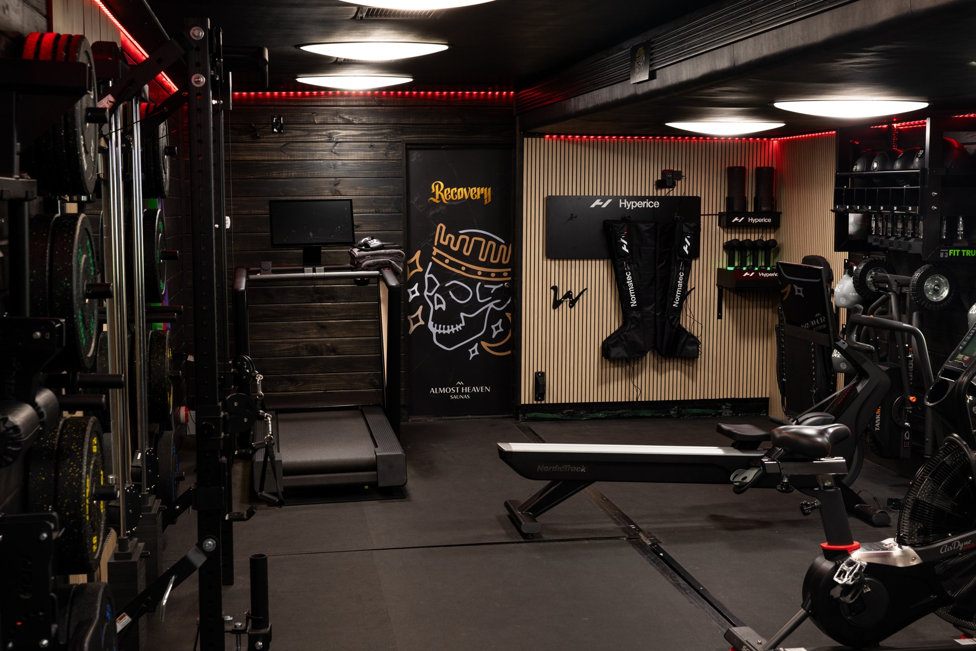 Custom gym trailer interior with dumbbell storage and exercise equipment
